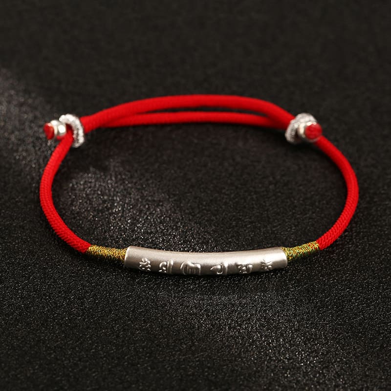 Protective Buddhist bracelet styled on a neutral background to showcase color and craftsmanship