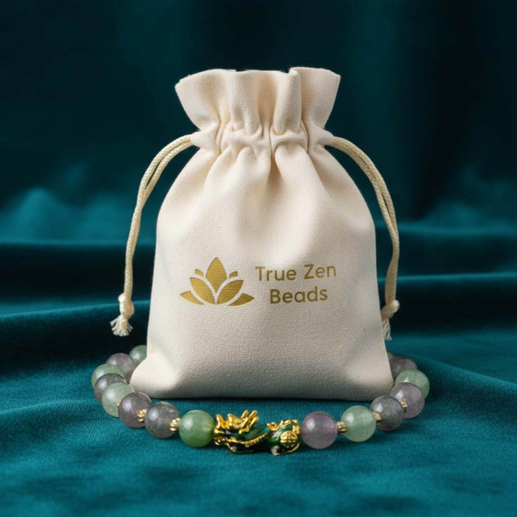 Color-changing Pixiu bracelet with synthetic thermochromic beads in green, purple and white displayed in TrueZenBeads branded gift bag packaging - color-shift jewelry ready for gifting