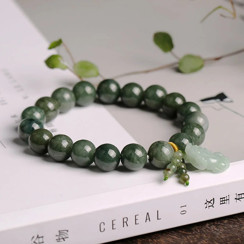 Feng shui wealth bracelet with Pixiu and green jade healing properties