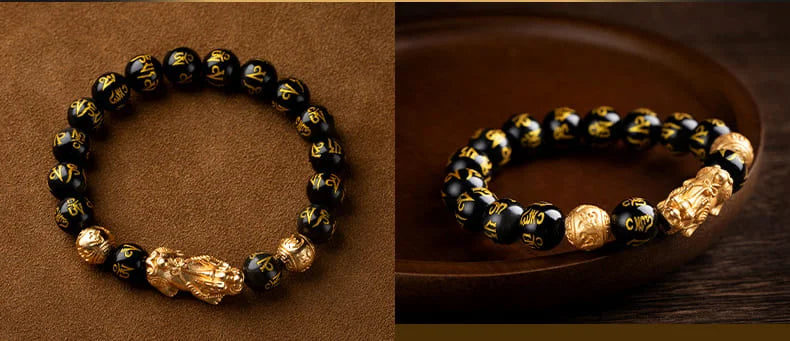 Detailed view of gold Chinese coins featured in the bracelet for attracting financial success