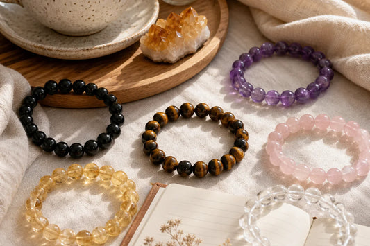 Crystal bracelets arranged with morning tea and journal for choosing the best time to wear crystal jewelry