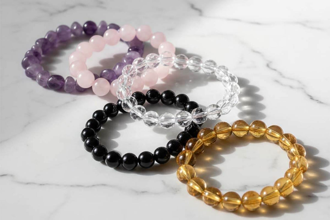 Complete feng shui crystals properties guide featuring 10 natural stones - amethyst, rose quartz, obsidian, tiger eye, and jade bracelets