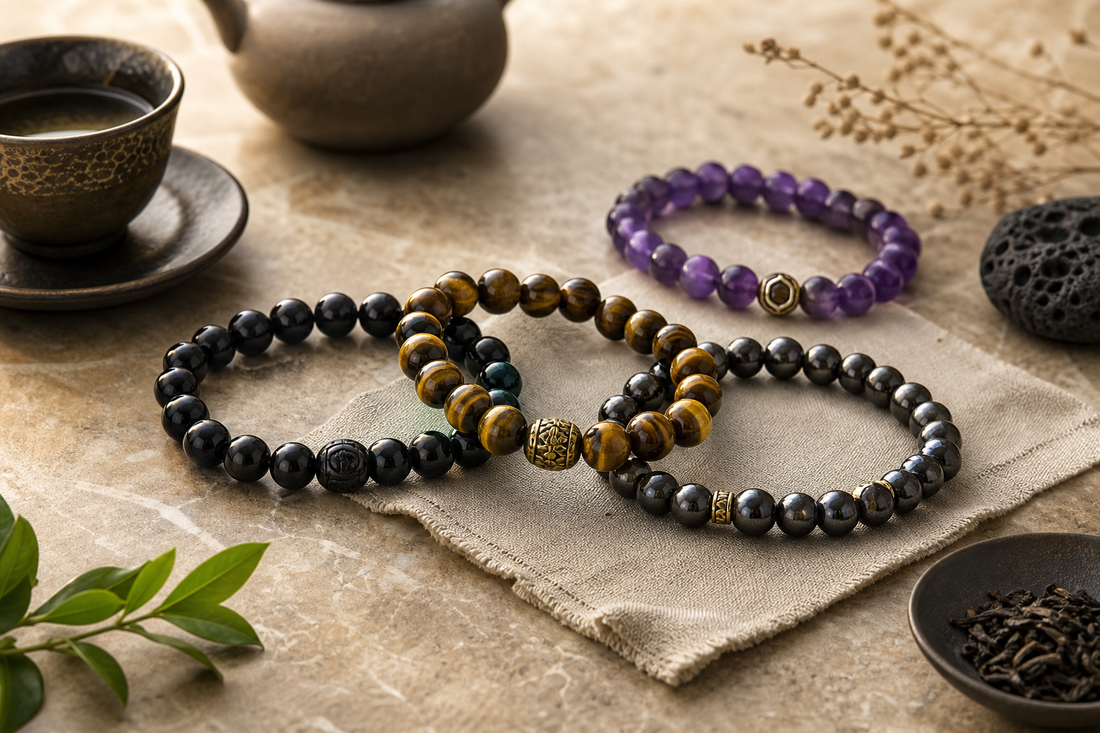 Grounding stones guide cover image with artisan black obsidian, tiger eye, amethyst, and metallic mineral bead bracelets