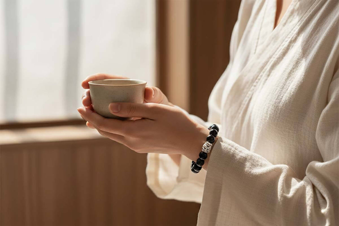 A person wearing a black obsidian Pixiu bracelet correctly on the left wrist | TrueZenBeads