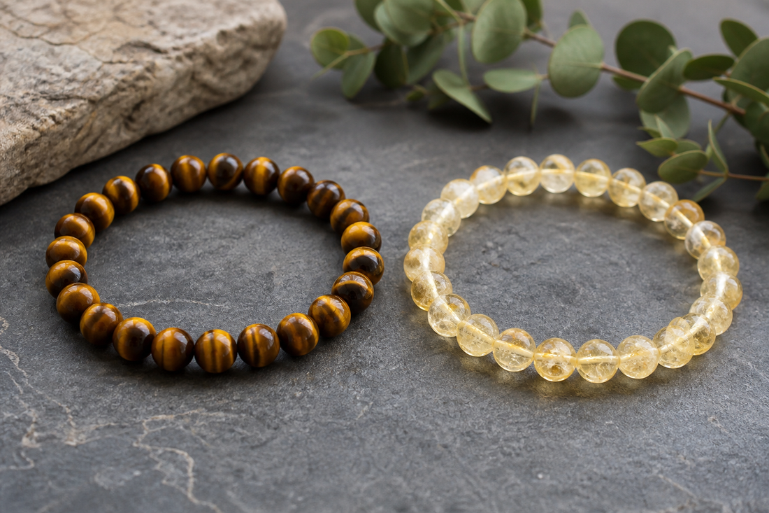 Tiger eye vs citrine comparison with a golden brown tiger eye bracelet beside a translucent yellow citrine bracelet