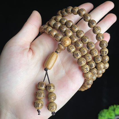 TrueZenBeads handcrafted wooden mala beads carved with sacred mantras for meditation practice