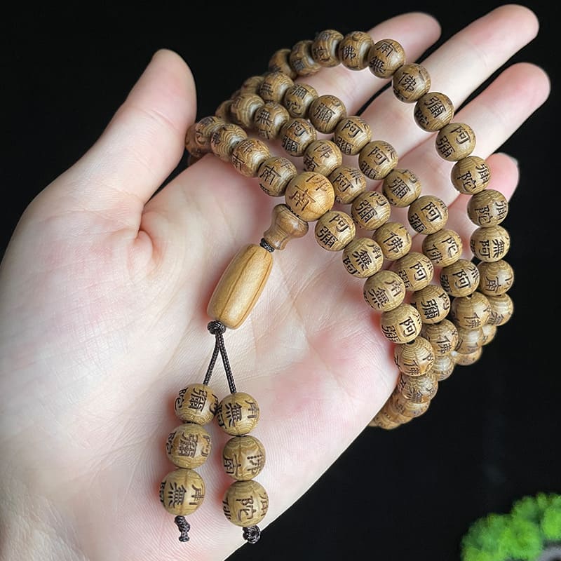 TrueZenBeads logo placed alongside carved wooden beads representing mindful living