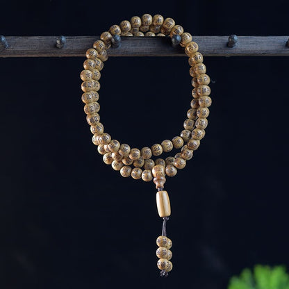 Natural wood mala bracelet designed for mindfulness, meditation, and spiritual grounding