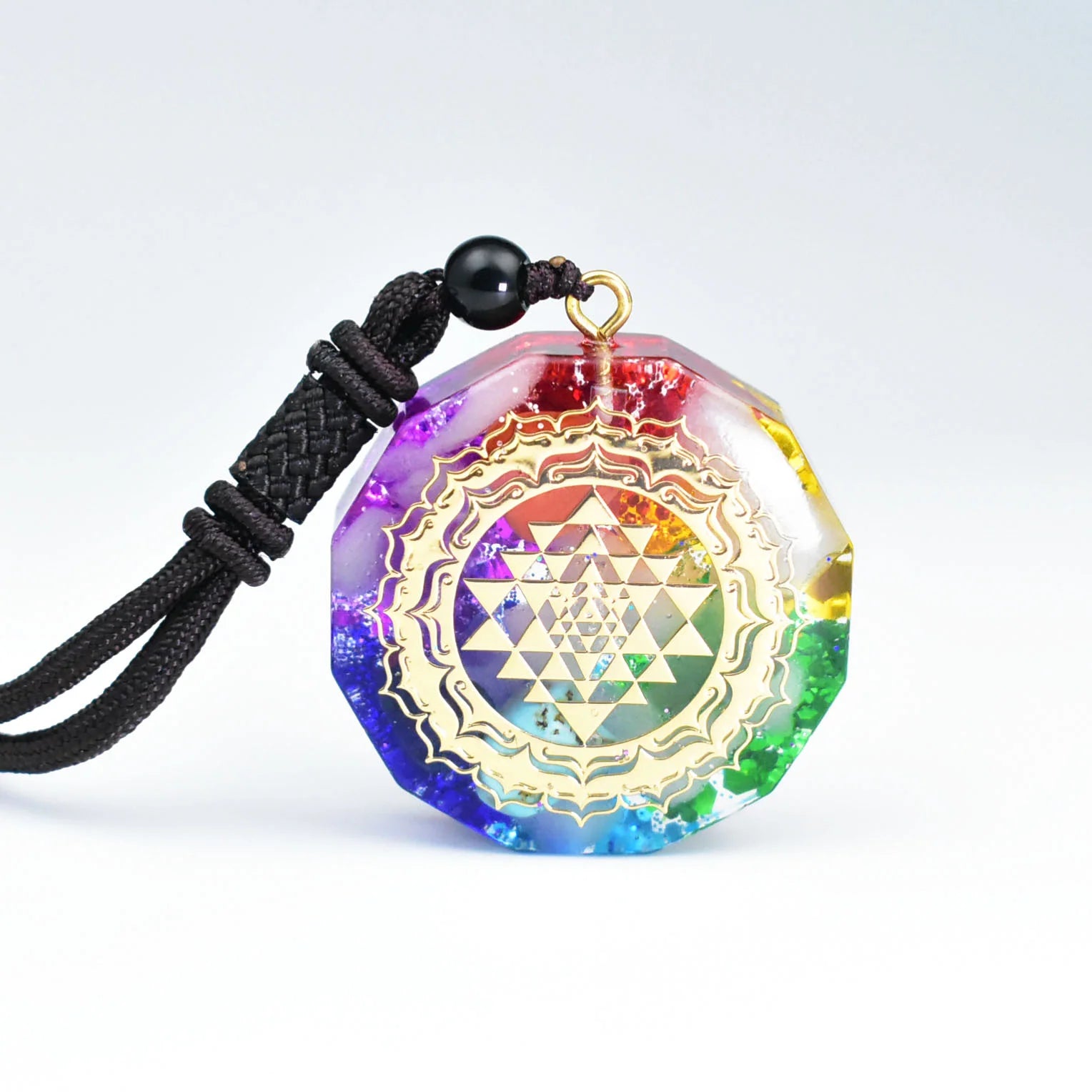 7 chakra orgonite resin necklace with golden Sri Yantra sacred geometry pattern and rainbow gradient