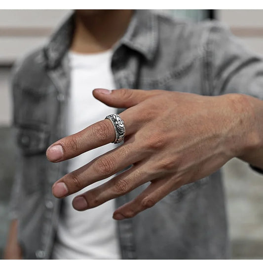 Close-up of gold Pixiu ring featuring Buddhist Om Mani Padme Hum mantra symbols
