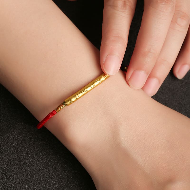 Unisex red Buddhist bracelet with adjustable knot clasp, symbolizing spiritual strength and fortune