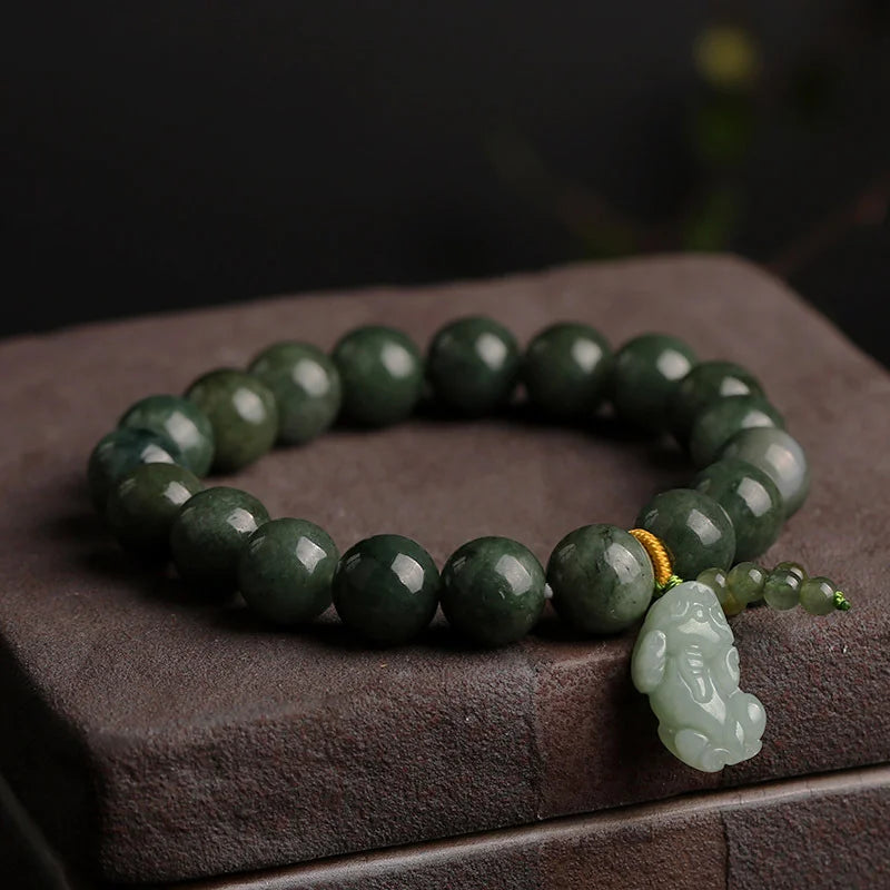 AAA grade green jadeite beads bracelet featuring traditional hand-carved Pixiu cultural motif