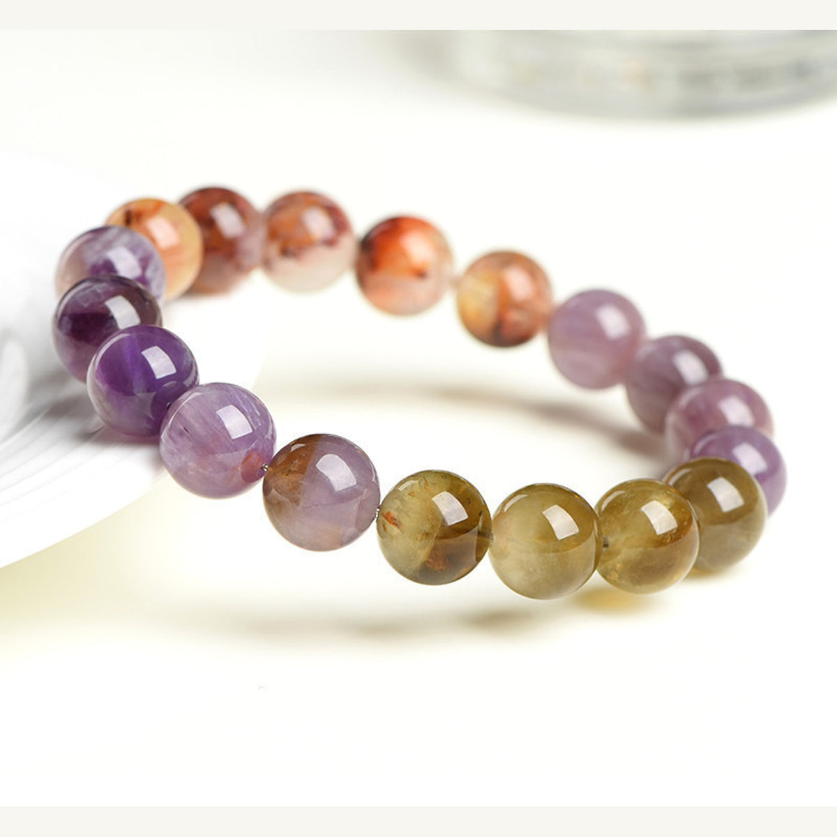 Auralite 23 Super Seven 5A full color bracelet on a clean light background