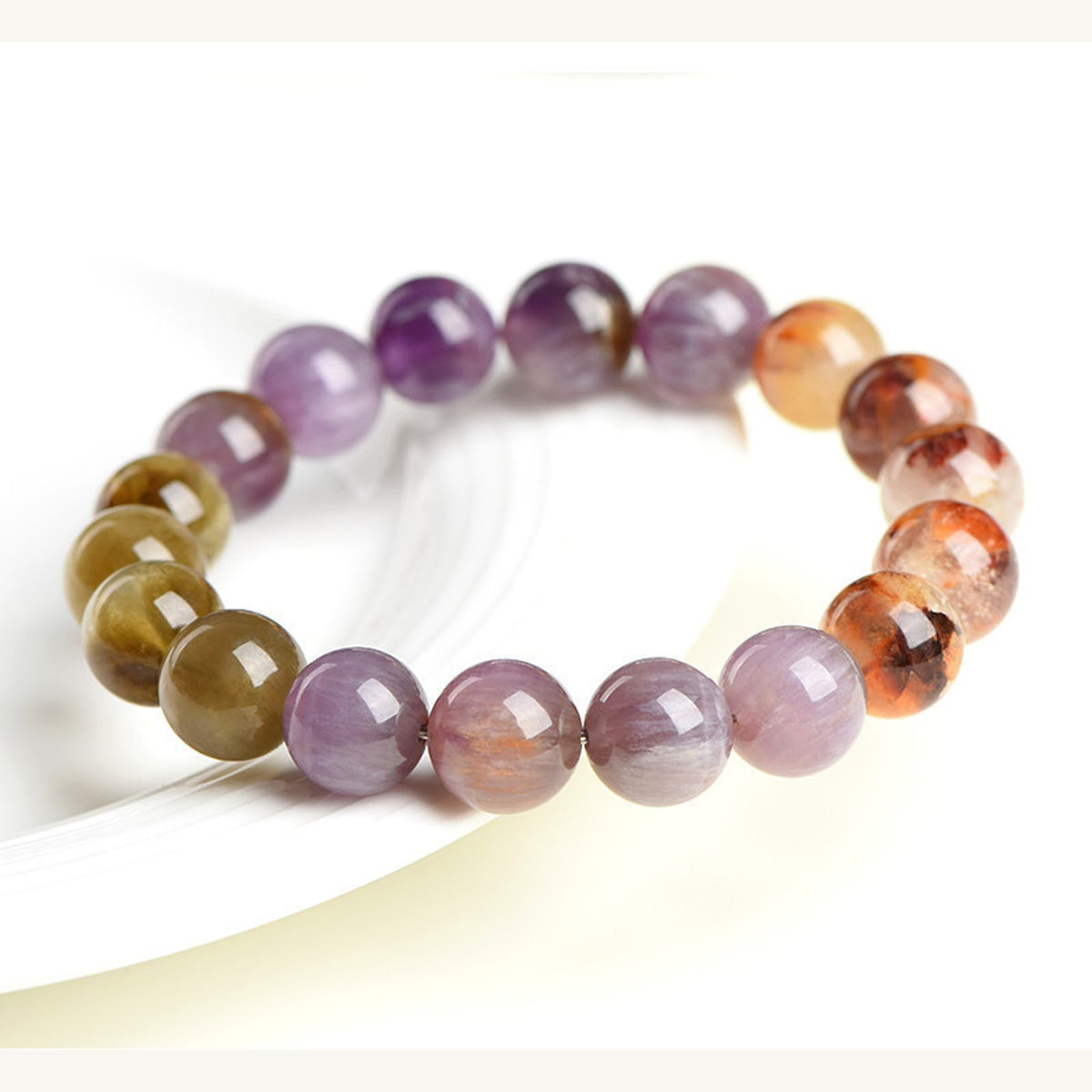 Side view of Auralite 23 Super Seven 5A full color bracelet beads