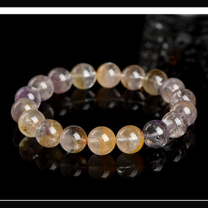 Auralite 23 Super Seven bracelet in 5A half basin finish on a clean black background
