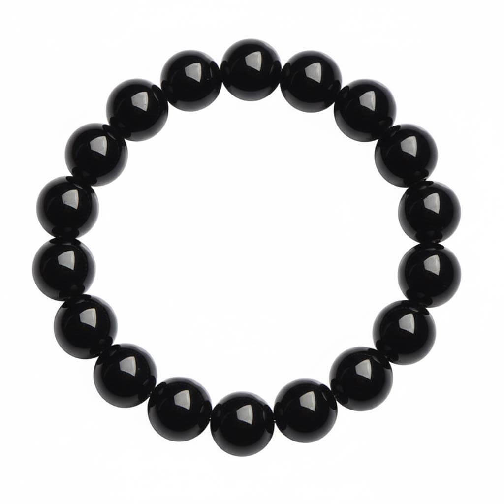 Black obsidian bracelet with polished mirror shine beads on white background - natural volcanic glass jewelry for men and women
