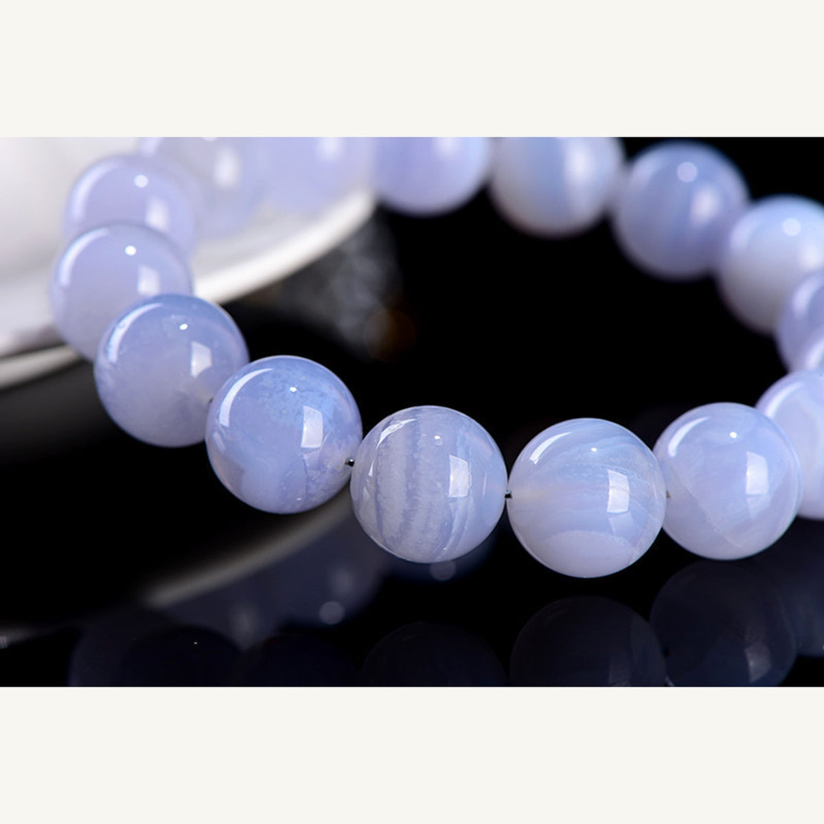 Close detail of blue lace agate bead banding and polished surface