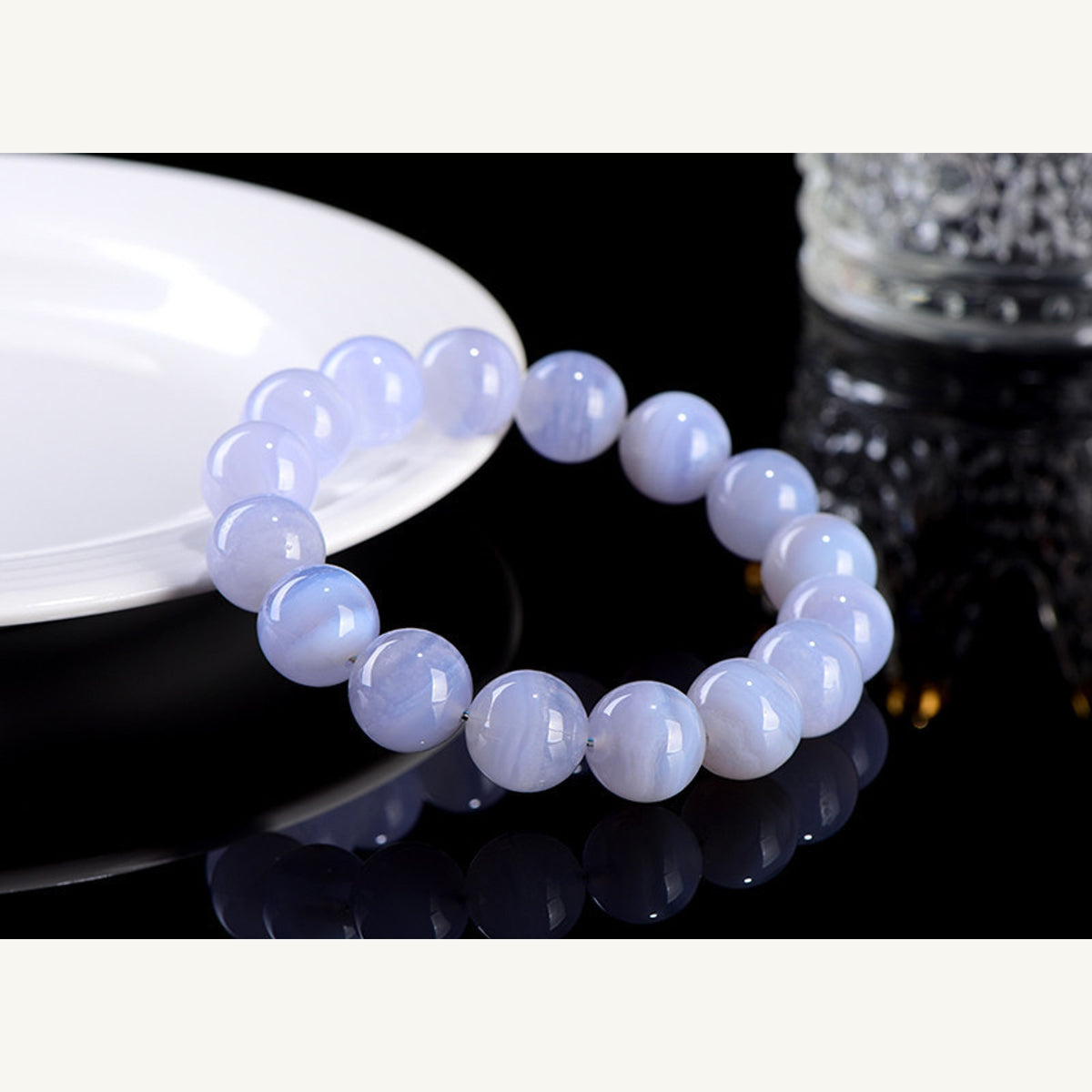 Blue lace agate bead bracelet on black reflective display