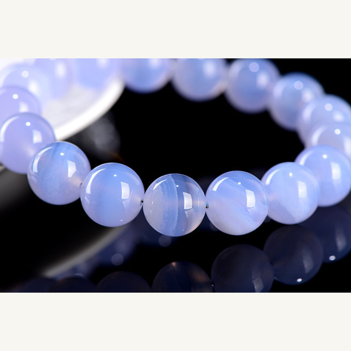 Closeup of polished blue lace agate round beads