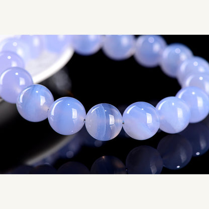 Closeup of polished blue lace agate round beads