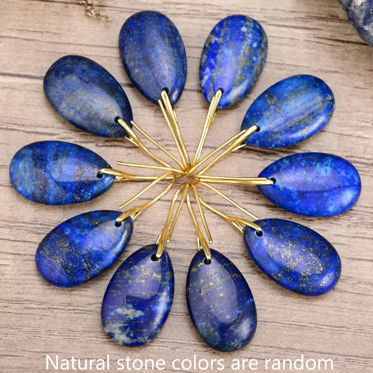 Close-up of blue lapis lazuli dangle earrings with polished natural stone texture