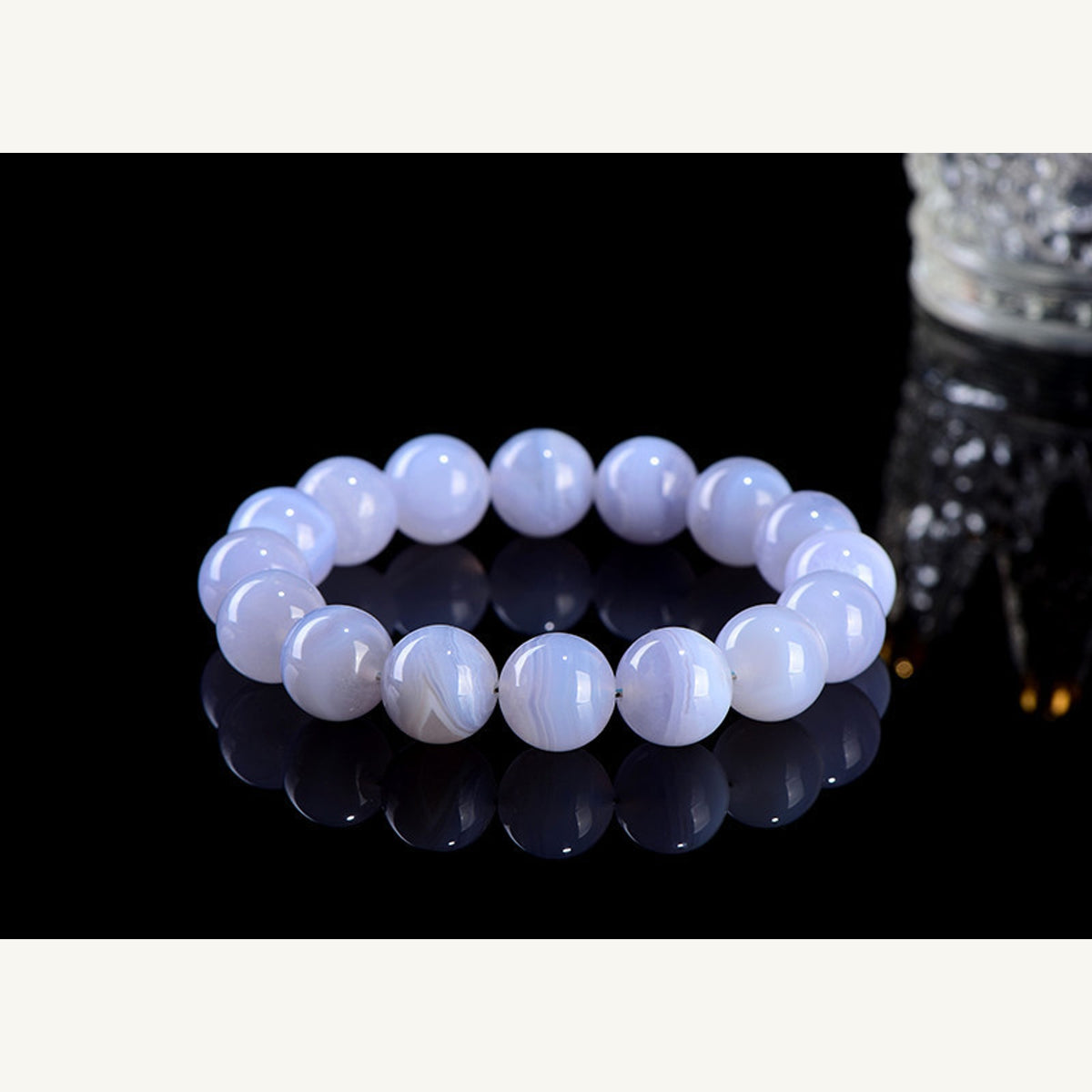 Blue striped agate stretch bracelet on dark display