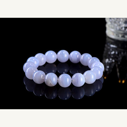 Blue striped agate stretch bracelet on dark display