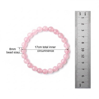Elastic Grapefruit Rose Crystal Bracelet showing 8mm bead size with warm pink tones