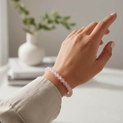 Woman wearing Grapefruit Pink Quartz Bracelet for elegant everyday style - warm peachy crystal jewelry