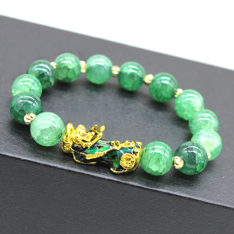 Green color-changing Pixiu bracelet with synthetic thermochromic beads showing color variation and gold-plated enamel Pixiu charm with intricate detailing