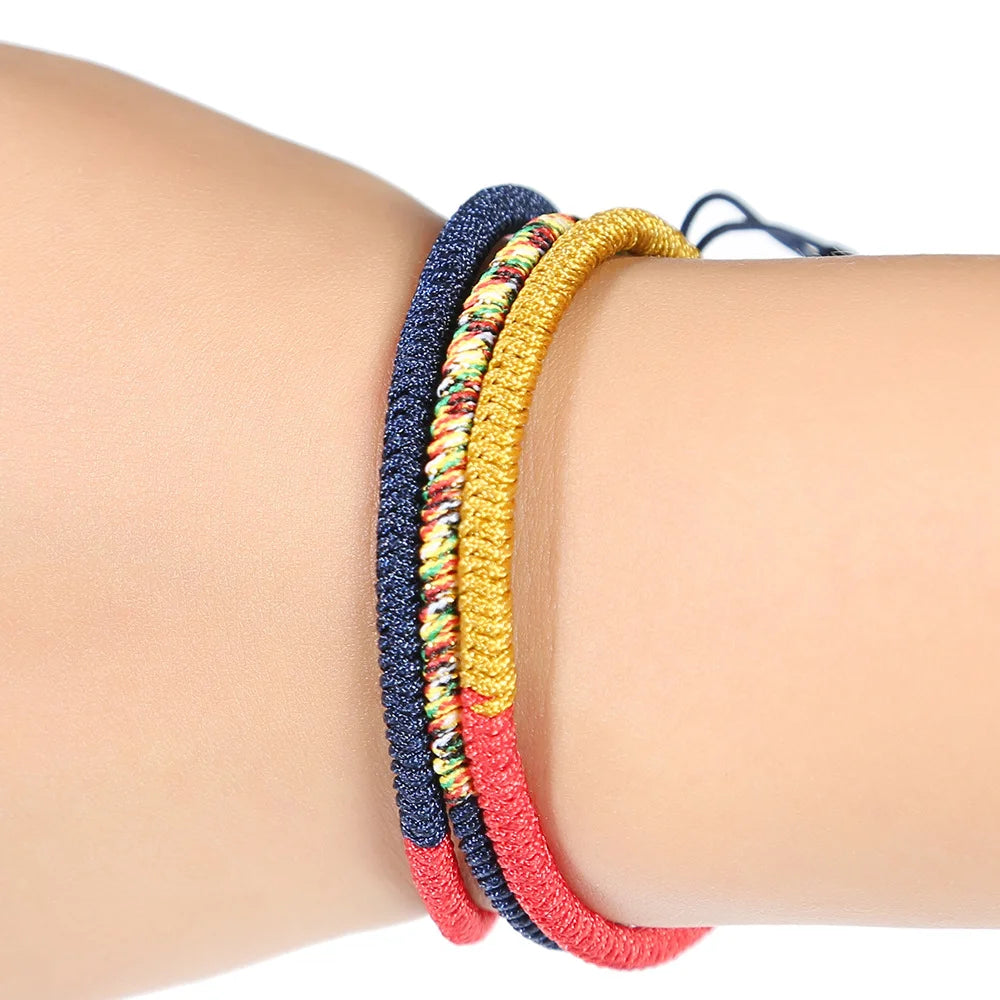 Tibetan lucky knot bracelets with deep red, yellow, and blue symbolic colors
