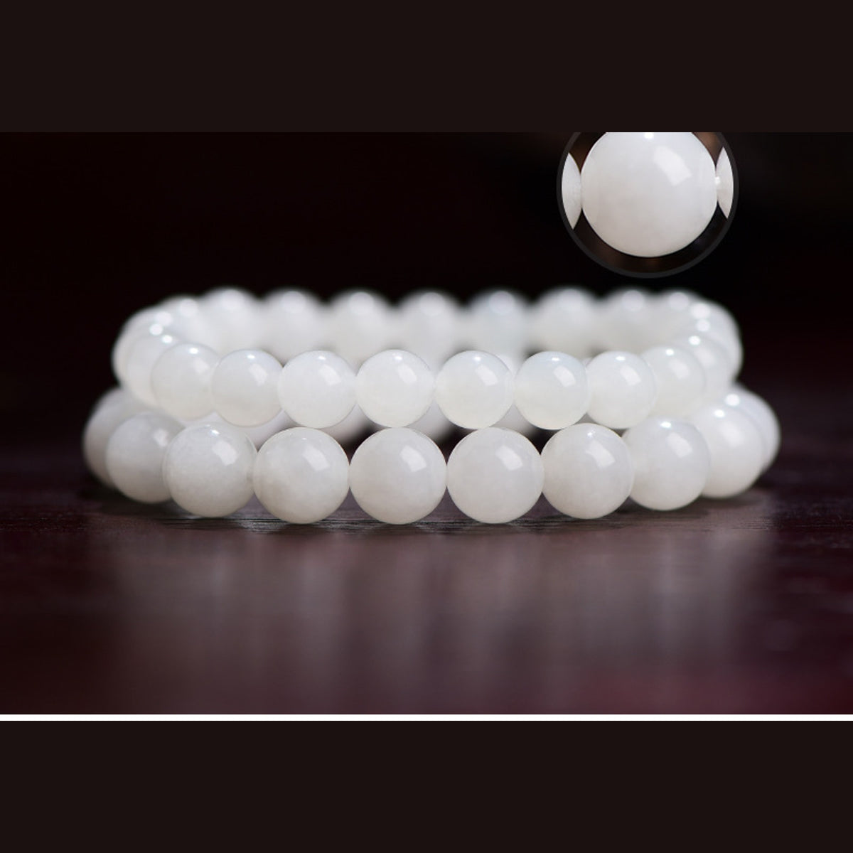 Close detail of polished Hetian white jade round bracelet beads