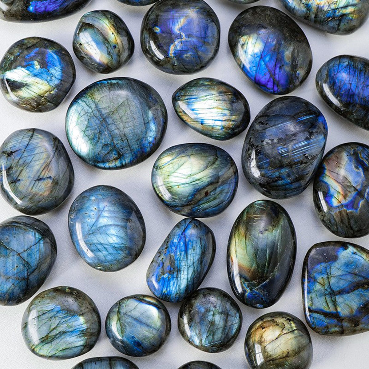 Selection of polished labradorite crystal palm stones