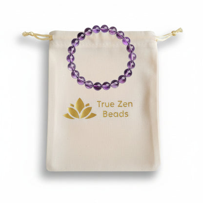 Light purple amethyst bracelet displayed with a True Zen Beads branded cotton pouch