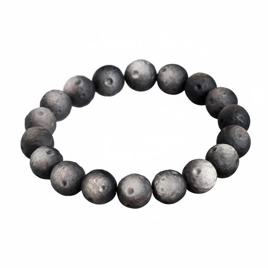Matte black obsidian bracelet with smooth frosted finish on white background - affordable protection crystal for beginners under 100 dollars