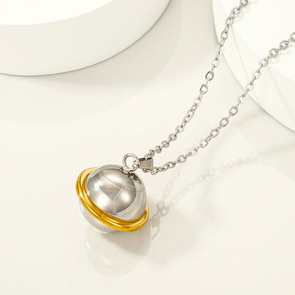 Close-up of polished stainless steel orb pendant necklace with chain
