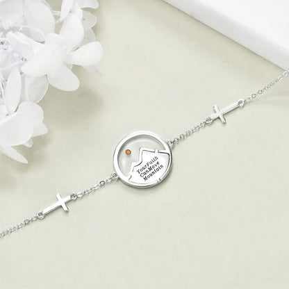 Mustard seed mountain bracelet close-up showing the Your Faith Can Move Mountains message
