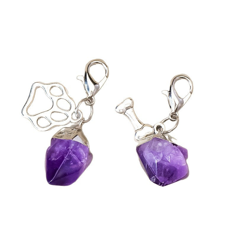 Natural amethyst crystal point pet collar charms on a clean white background