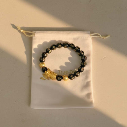 Natural Black Obsidian Pixiu Bracelet displayed in TrueZenBeads branded gift bag packaging - Buddhist cultural jewelry ready for gifting