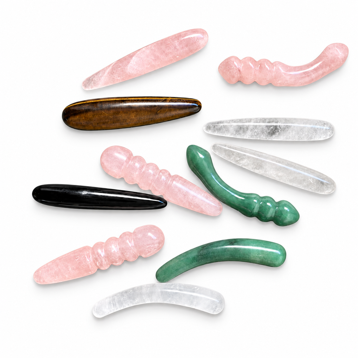 Natural crystal massage wand collection in rose quartz, clear quartz, tiger's eye, obsidian, and green aventurine