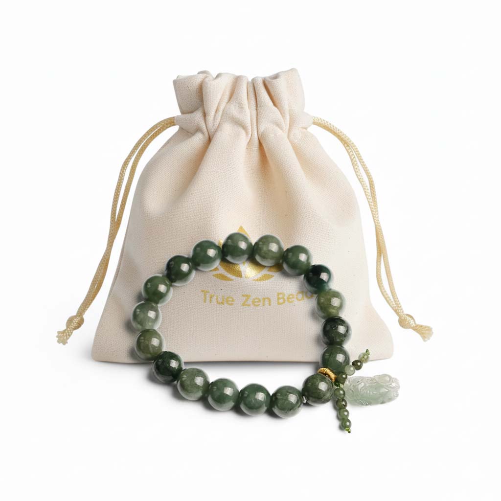 Natural Green Jade Pixiu Bracelet displayed in TrueZenBeads branded gift bag packaging with golden lotus logo - hand-carved cultural jewelry ready for gifting
