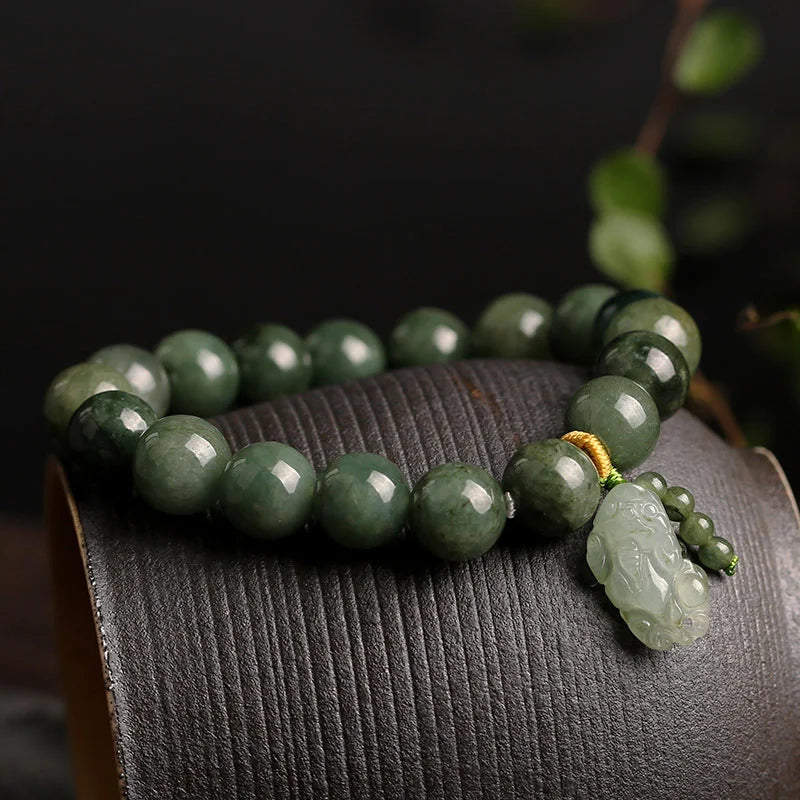 Natural green jadeite beads showing translucent quality polished surface and authentic color variations