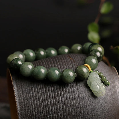 Natural green jadeite beads showing translucent quality polished surface and authentic color variations