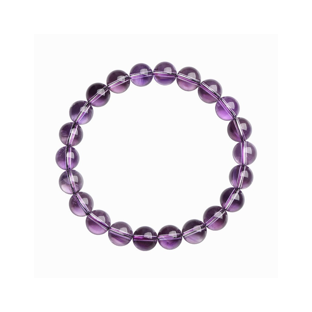 Natural light purple amethyst bracelet with polished round beads on a white background