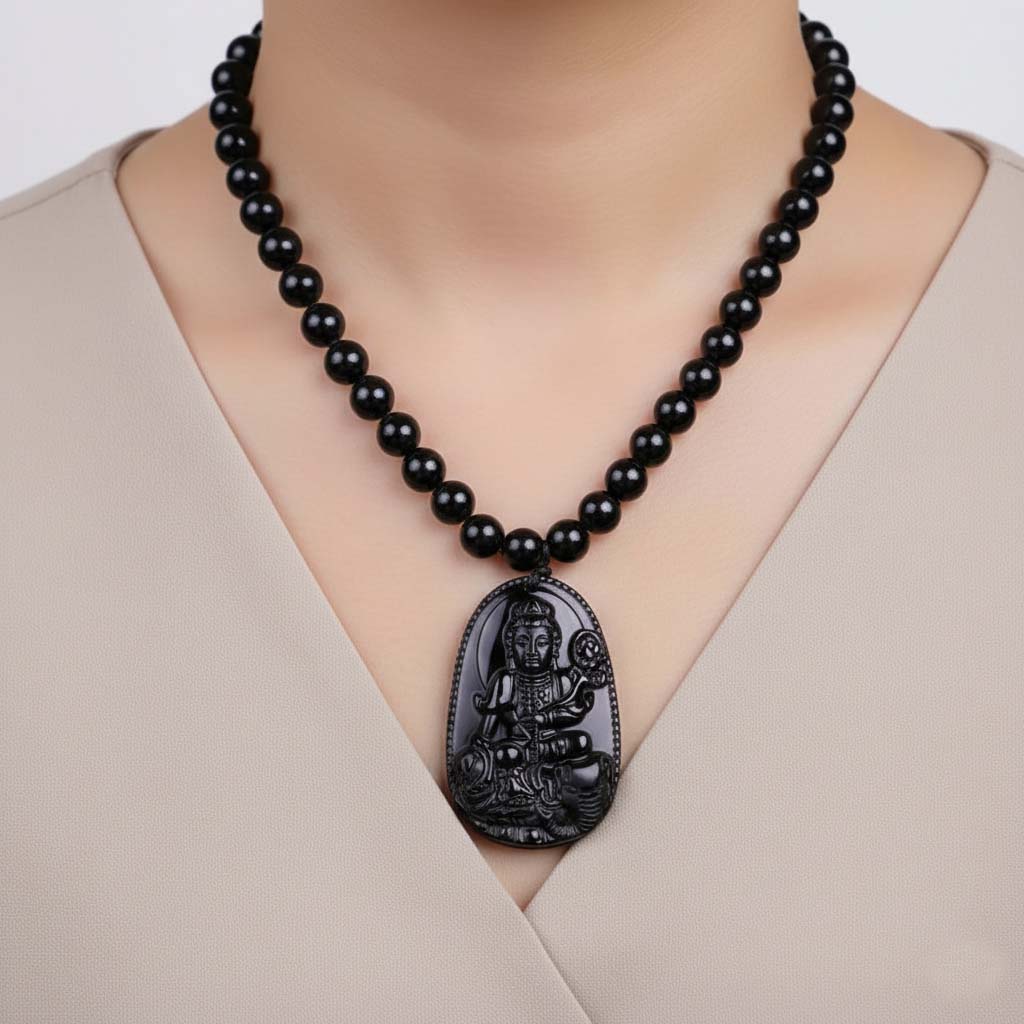 Person wearing Obsidian Stone Guardian Pendant for spiritual protection and daily mindfulness