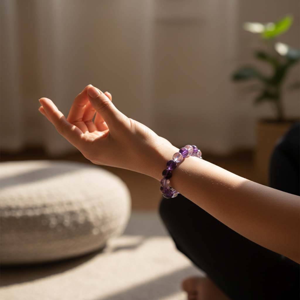 Person wearing Purple Amethyst Crystal Bracelet for elegant everyday style - natural violet crystal jewelry