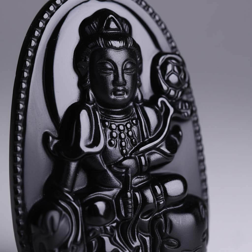 Close-up of Samantabhadra carving detail showing volcanic glass texture and smooth polished surface
