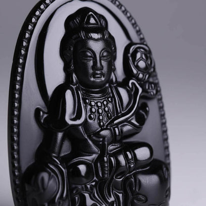 Close-up of Samantabhadra carving detail showing volcanic glass texture and smooth polished surface