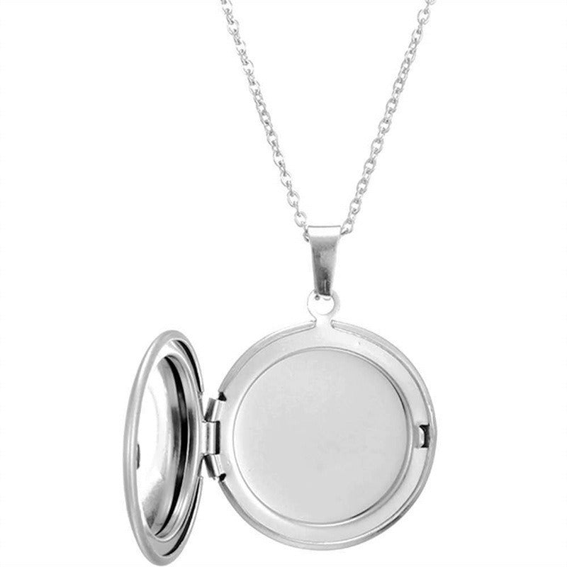 Silver round photo locket necklace opened to show blank photo compartment