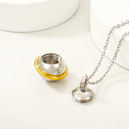 Open stainless steel keepsake pendant showing threaded compartment detail